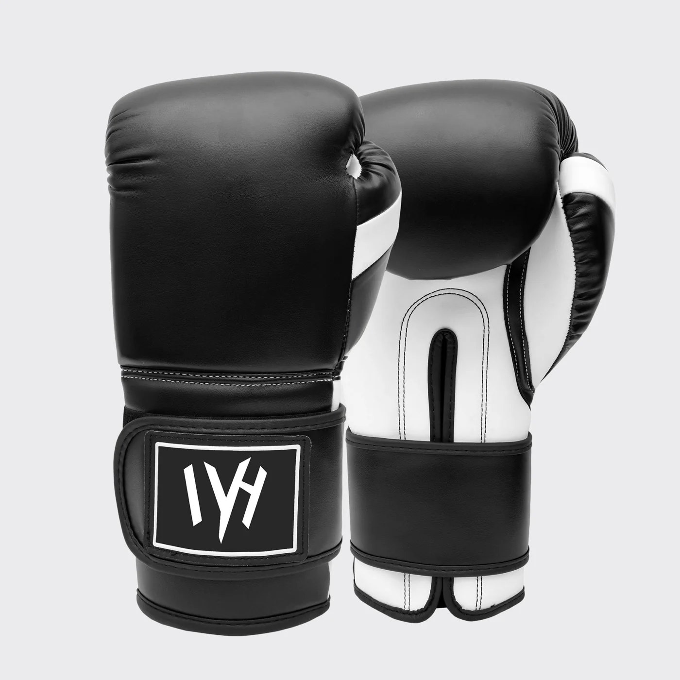 mayhm premium boxing gloves MAYHM Premium Boxing Gloves in black and white featuring multi-layer foam padding, secure wrist support, and premium construction for boxing training, sparring, and bag work.